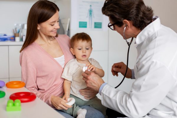 young mother with toddle pediatrician consultation